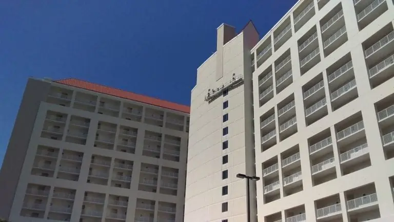 North elevation of Tides at TOPS'L during exterior restoration with access equipment in place, Miramar Beach, Florida.